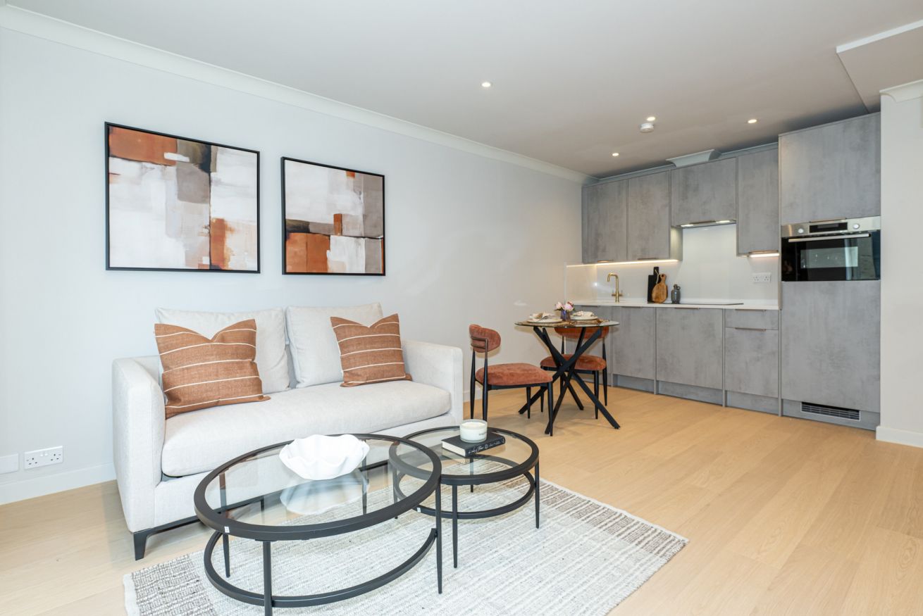 Bright living room in a Regents Plaza apartment, set up for a longer stay
